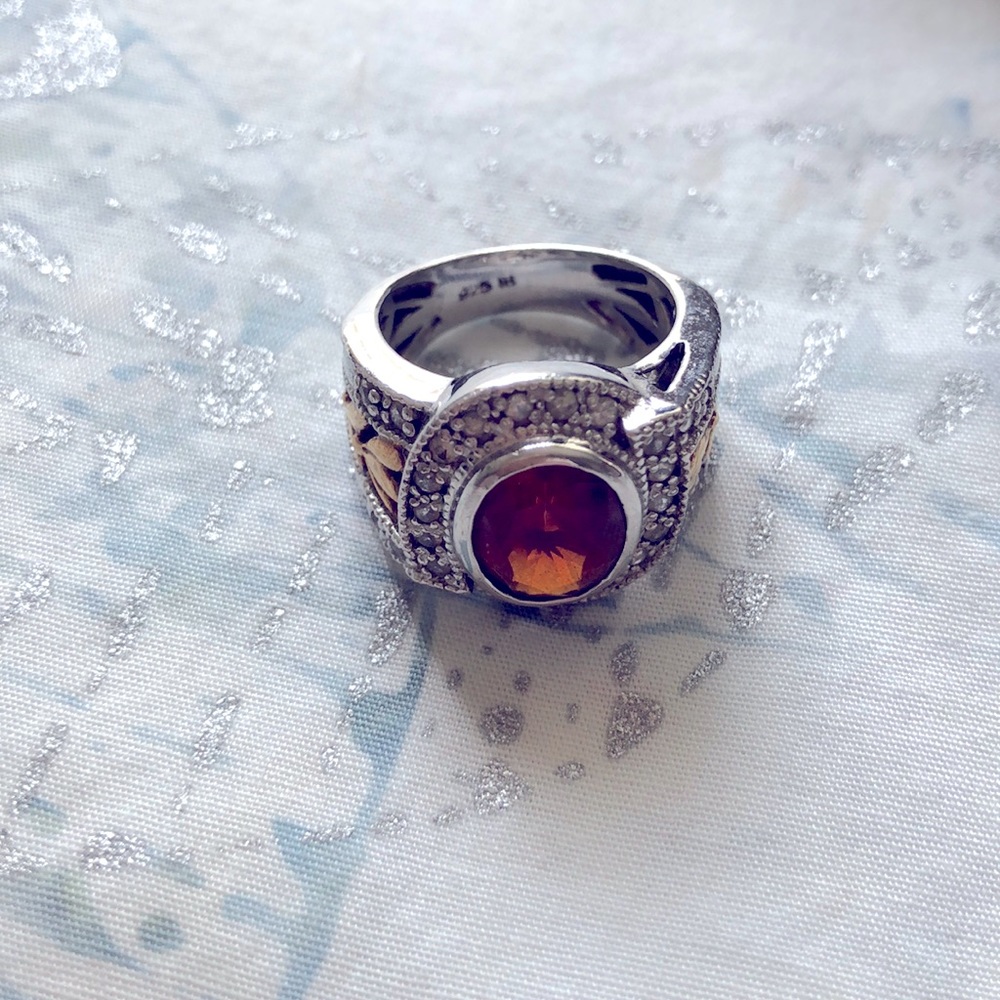 Silver & gold ring size 5. Garnet?